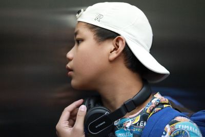 Portrait of teenage boy looking away