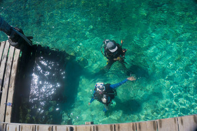 High angle view of scuba divers in sea