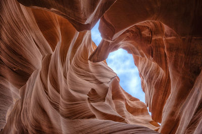 Low angle view of rock formations against sky