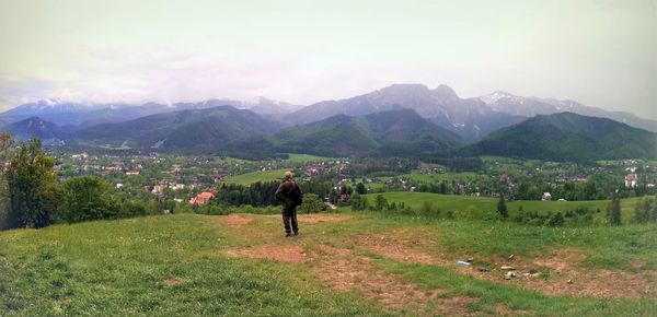 Woman looking at mountain landscape