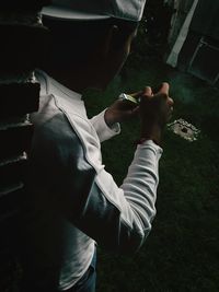 High angle view of man smoking outdoors