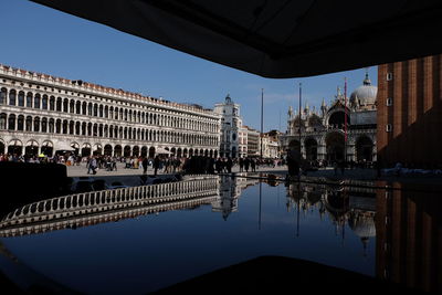 Reflection of place and st mark cathedral on pond