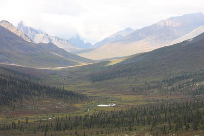 Scenic view of landscape and mountains against sky