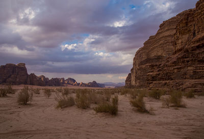 Rock formations in desert against sky