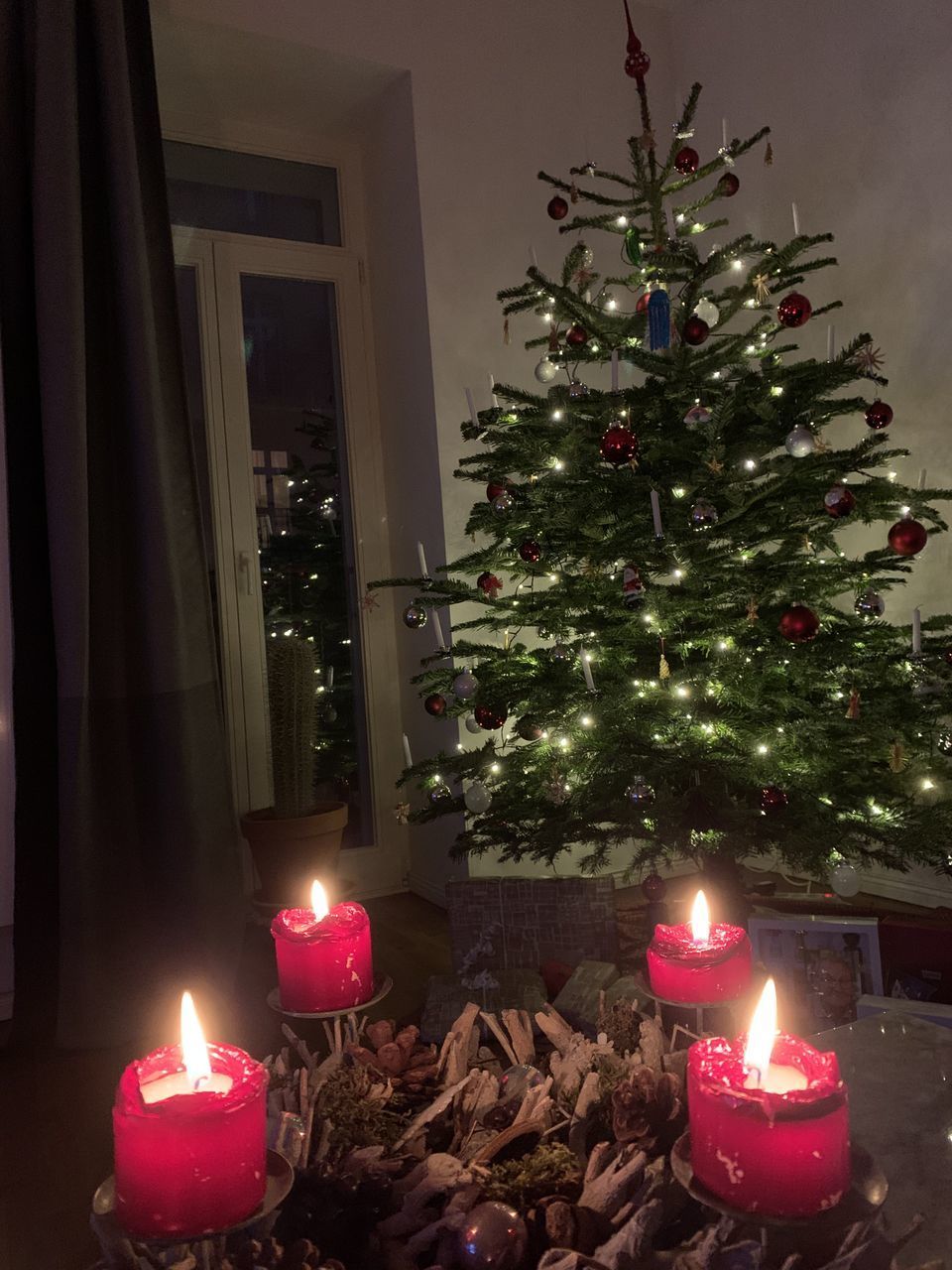 ILLUMINATED CHRISTMAS TREE AT SIDEWALK