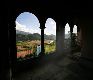 Buildings seen through arch window