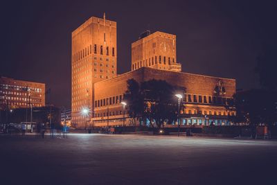 Illuminated buildings in city at night