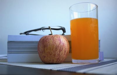 Close-up of orange juice on table