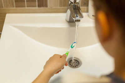 Midsection of woman in bathroom