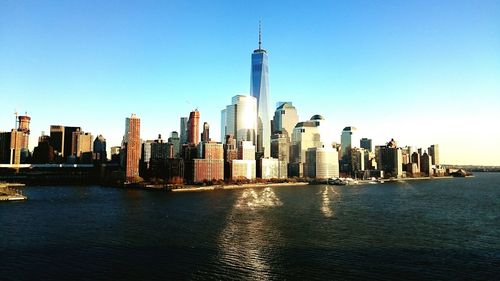 Skyscrapers in city against clear sky