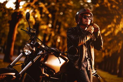 Portrait of man by motorcycle