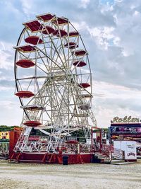 Low angle view of ferris wheel against sky