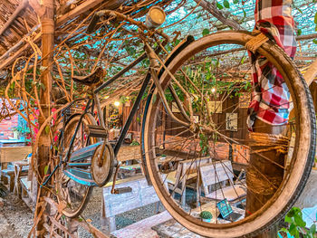 Reflection of man and woman on bicycle