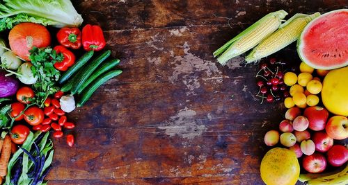 Directly above shot of multi colored fruits and vegetables on table