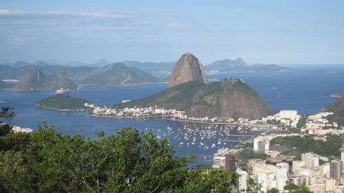 High angle view of cityscape by sugarloaf mountain against sky