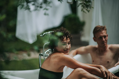 Young couple looking at camera