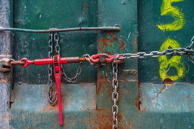 Close-up of padlock on metal gate