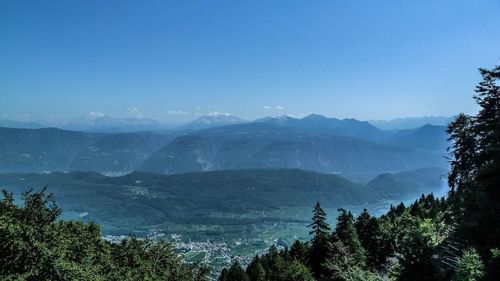 Scenic view of mountains against clear blue sky