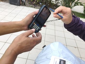 High angle view of man using mobile phone