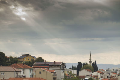 High angle view of buildings in town against sky