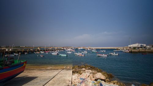 Boats moored in sea