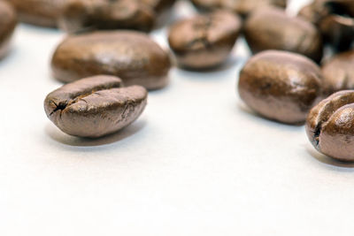 Close-up of coffee beans on table