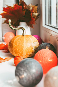 Seasonal autumn home decoration of dried leaves and pumpkin