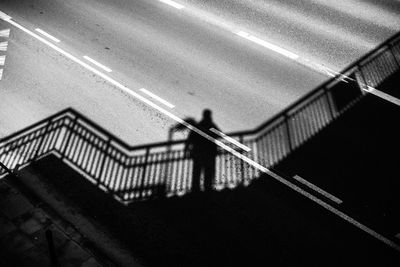 High angle view of people walking on staircase