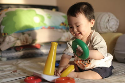 Boy playing with toy at home