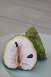 High angle view of fruit in plate on table