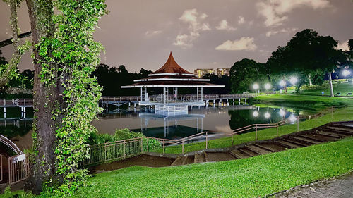 Scenic view of lake by building against sky