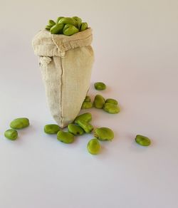 Close-up of vegetables on table against white background