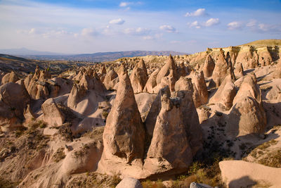 Panoramic view of rock formations against sky