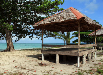 Built structure on beach against sky