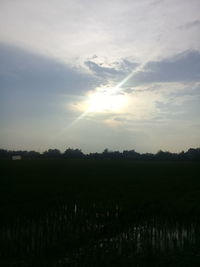 Scenic view of field against sky during sunset