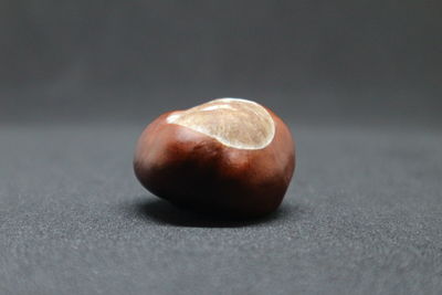 Close-up of chestnut on table