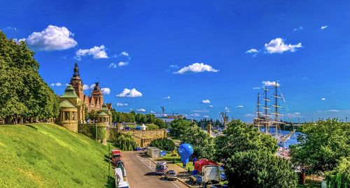 Panoramic view of buildings against blue sky
