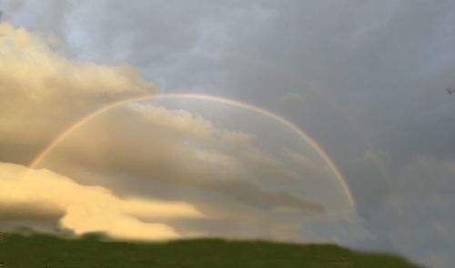 Low angle view of rainbow against sky