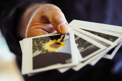 Midsection of man holding instant print transfers