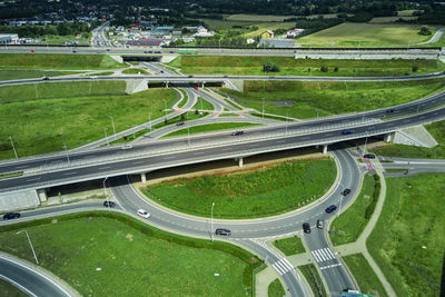 Roundabout intersection with driving cars. car traffic on highway with junction in wroclaw, poland