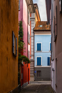 Colorful houses lined along a picturesque cobbled alley in locarno old town, switzerland