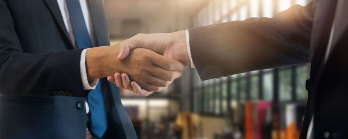 Close-up of business people shaking hands