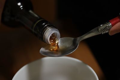 Close-up of pouring coffee in glass