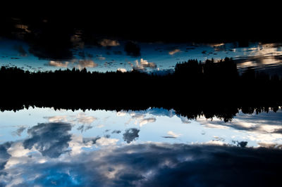 Scenic view of silhouette trees against sky