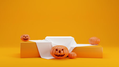 Close-up of stuffed toy against yellow background