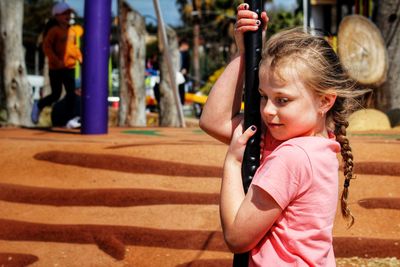 Girl with outdoor play equipment