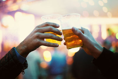 Cropped hand of woman holding drink