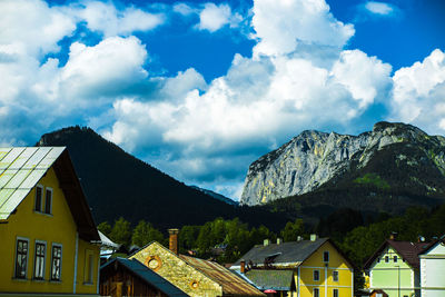 Low angle view of houses and buildings against sky