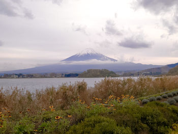 Scenic fuji view of snowcapped mountains against sky