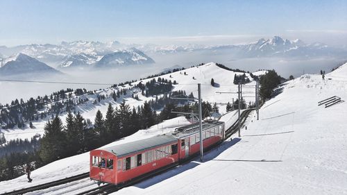 High angle view of train on snow covered mountain